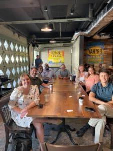 People around a table at a Lacy School of Business Meet and Greet